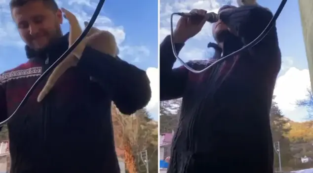 The uninvited guest of the imam reciting the call to prayer on camera.