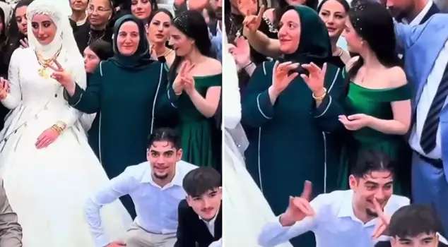 The mother who made a mark at the wedding where everyone was making the Grey Wolf sign: Her daughter intervened.