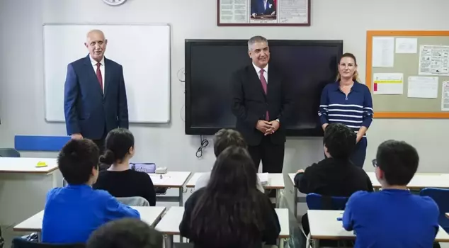 Father, daughter, son, and daughter-in-law are all working at the same school.