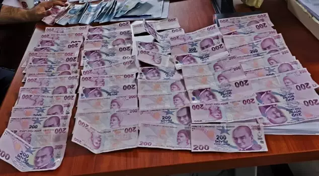 The teams couldn't finish counting the money that came out from under the beggar.