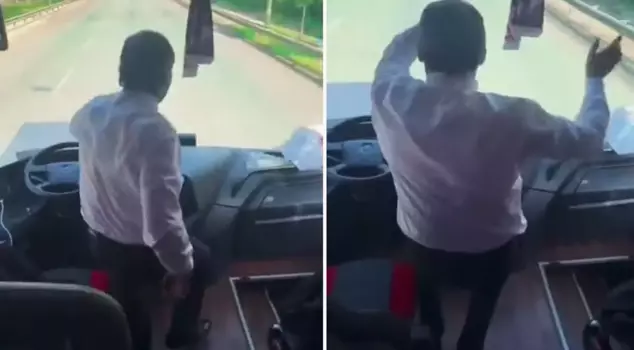 The driver who took the fans to the away game stood up and played while the vehicle was in motion.