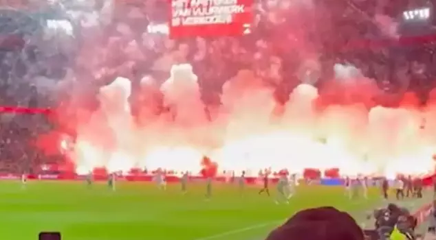 The Ajax fans practically set the stadium on fire, and the referee postponed the match.