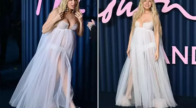 The famous actress announced her pregnancy on the red carpet in a tulle dress.