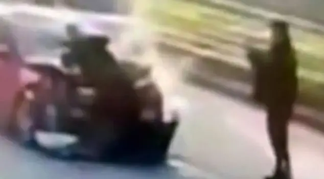 The police officer, who is married to his ex-wife, was first run over by a vehicle and then had his photo taken and shared on social media.