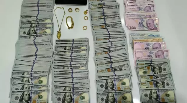 During the police operation, money and gold gushed out from everywhere.