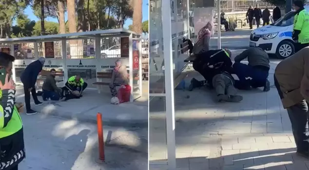 The elderly man who collapsed on the ground at the bus stop was revived by the police.