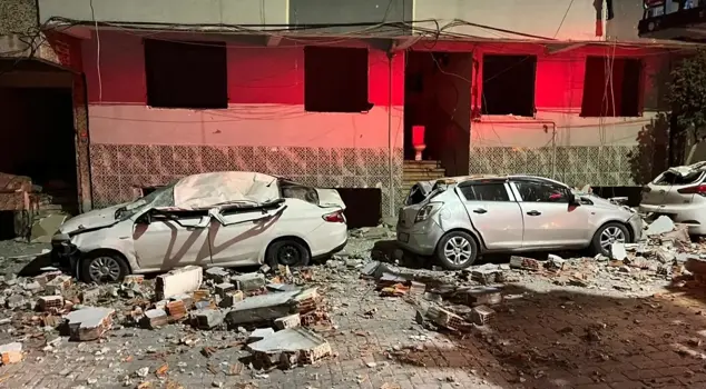 Parts that broke off from the building's roof turned the vehicles into scrap.