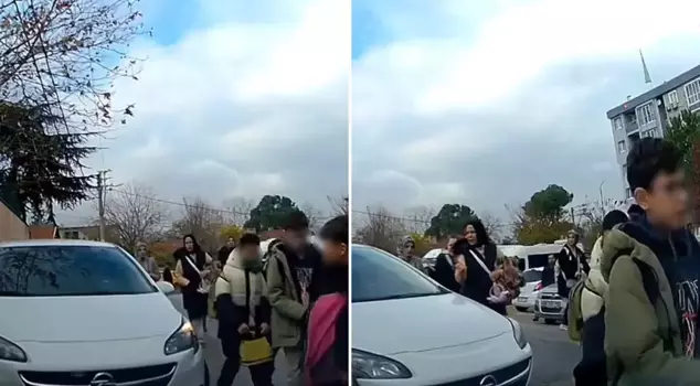 The car ran over the students who were leaving the school.