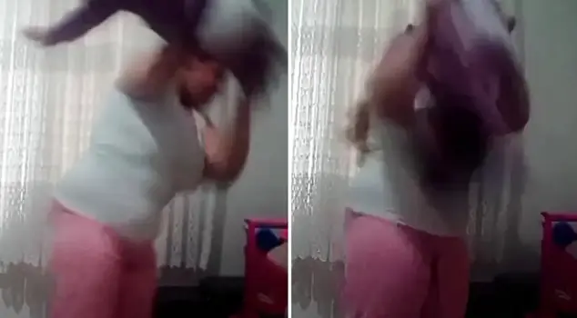 Mother violence on camera against a 1-year-old baby.
