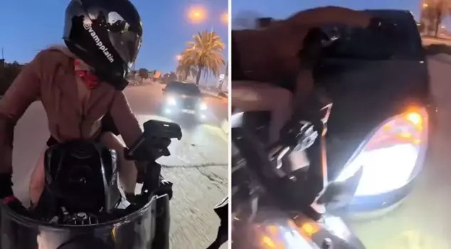 The woman motorcyclist was hit by a car coming from behind.