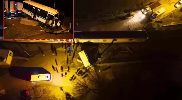 The train hit the minibus stranded on the tracks.