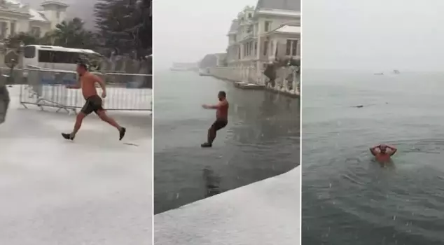 He didn't mind the snowfall: enjoying the sea at -6 degrees.