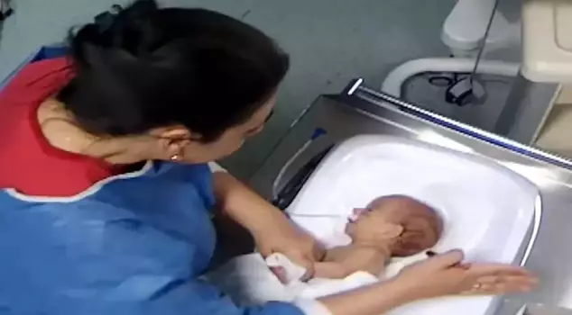 The heartless nurse who left a 5-day-old baby disabled has surrendered.