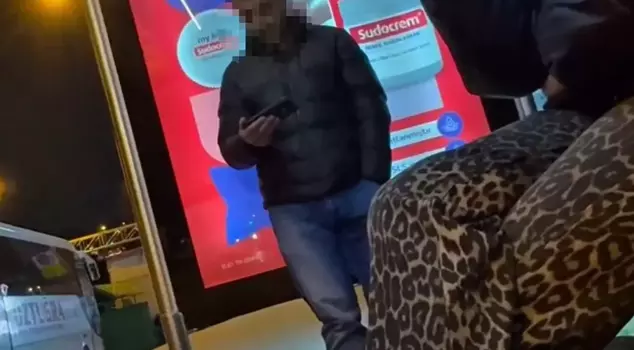 Scandalous scene at the bus stop: Looking at the women in front of him...