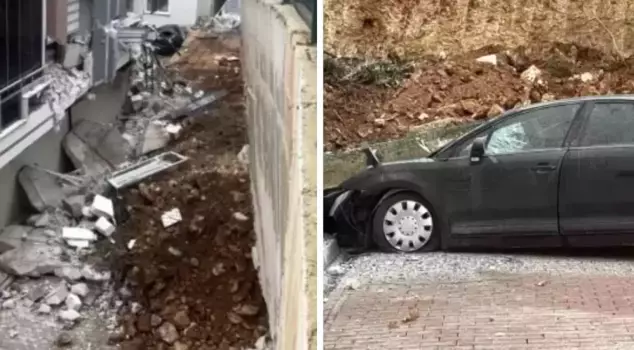 A disaster was averted! The retaining wall collapsed onto the vehicles.