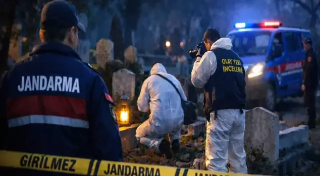 A woman's body was found in the cemetery, strangled with a rope.