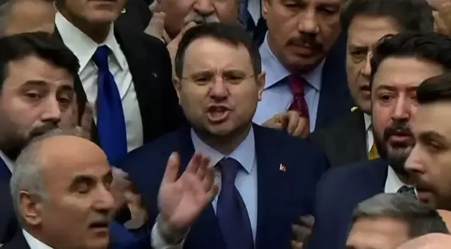 Akın Gürlek swore in at the podium, where AK Party deputies built a wall of flesh.
