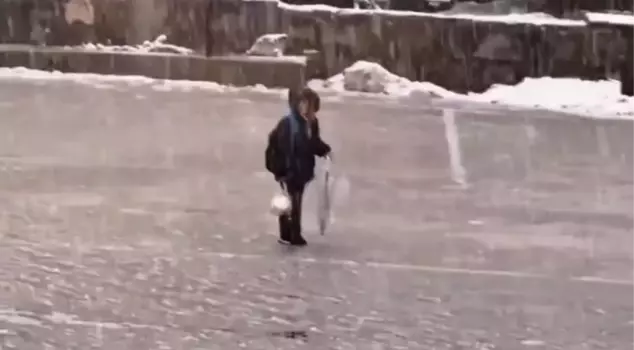A child reading the National Anthem under the snow warmed hearts.
