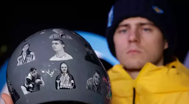 Ukrainian athlete disqualified due to memorial helmet.