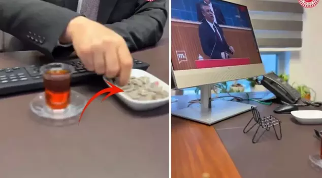 An AK Party deputy watched Özgür Özel while eating sunflower seeds in the Parliament.