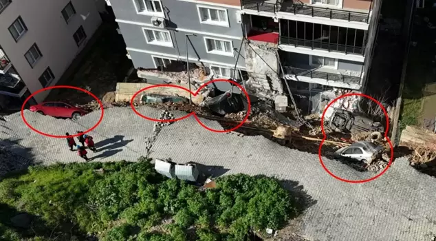 The collapsed retaining wall swallowed 7 vehicles.