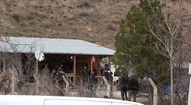 A dead body was found in a house that was entered through a broken window.
