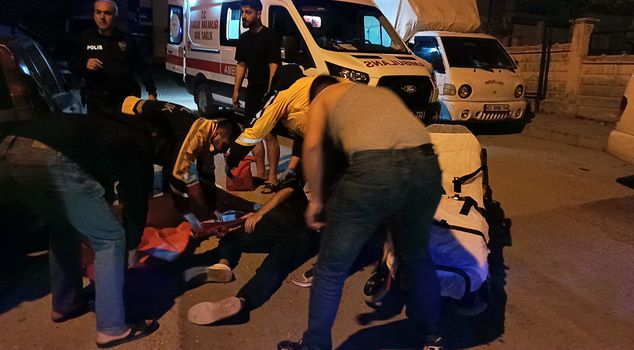 A university student was stabbed in the back in front of his house.