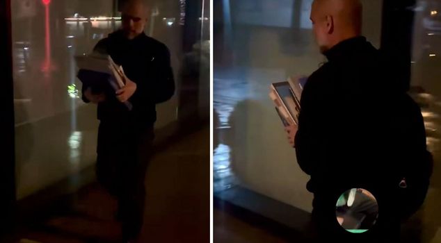 Guardiola, who lost the championship, was seen on the street with his books.