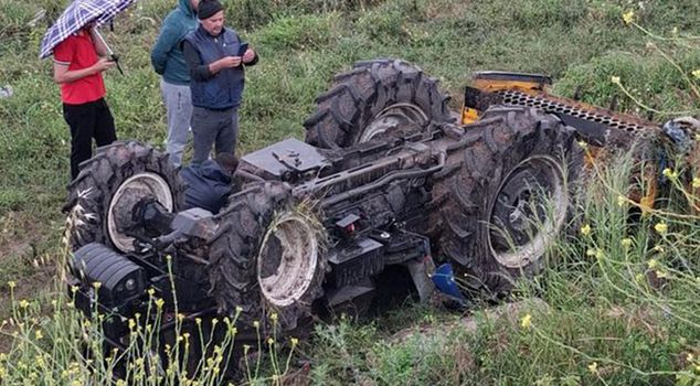 He lost his life under the overturned tractor.