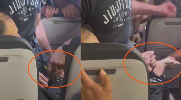 The plane changed its route because of a passenger trying to open the exit door.