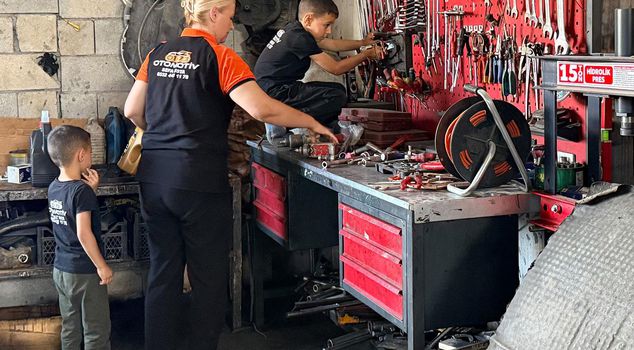 She came to her husband's vehicle repair workshop to leave food, he is a motor mechanic.