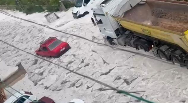 Heavy rain and hail hit the capital, bringing life to a standstill.
