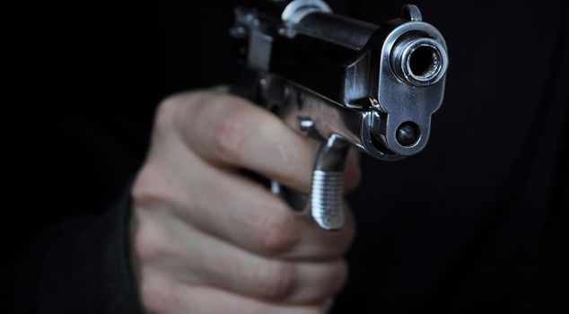 He shot and killed his father with a pistol after arguing.