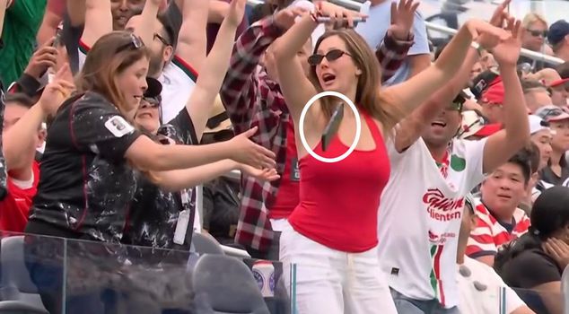 The woman doing the Mexican wave experienced the shock of her life as a result of a moment of inattention.