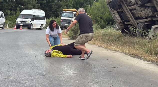 The driver of the truck that overturned after its brakes failed died; his relatives wailed.