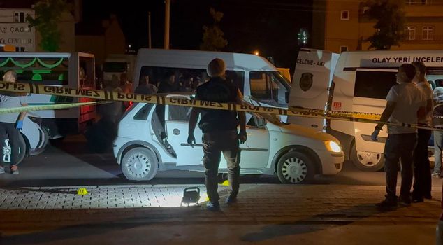 A woman was found dead and one person seriously injured in a car on the side of the road.