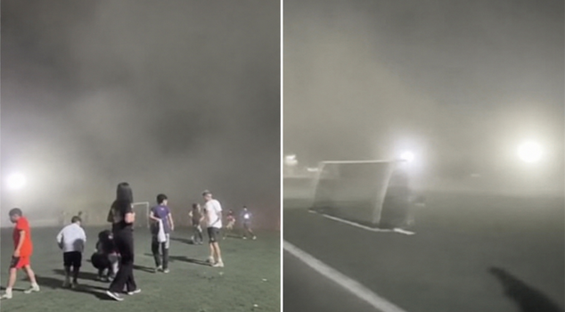 The storm engulfed the field in a cloud of dust, and the match was suspended.