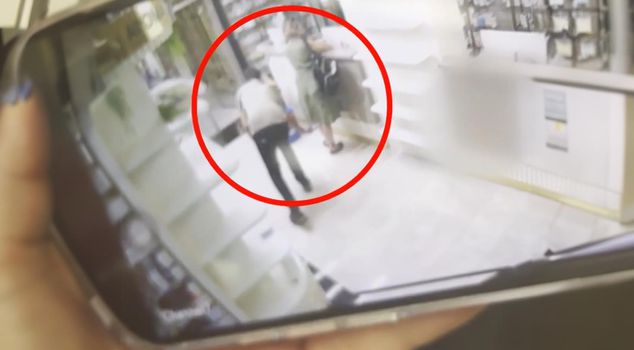 The pharmacist who took a photo up the customer's skirt was caught red-handed by his wife.