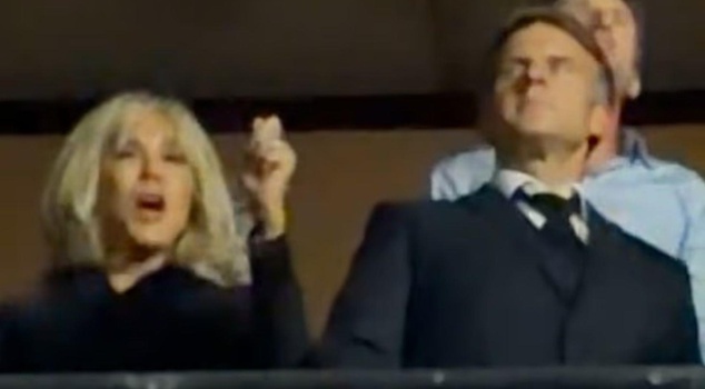 As clashes intensify in Paris, the Macrons were seen dancing at a concert.