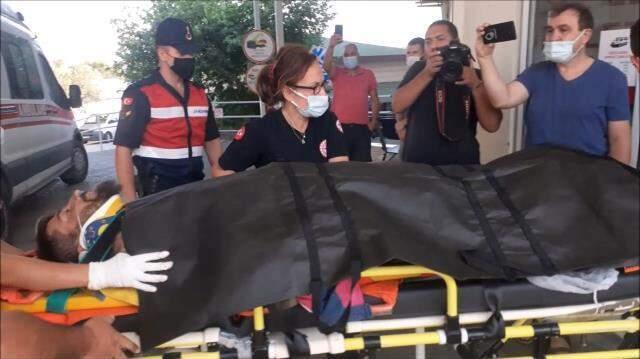 Kazdağları'nda yangından kaçan ayı, alevlerle mücadele eden gönüllüye saldırdı