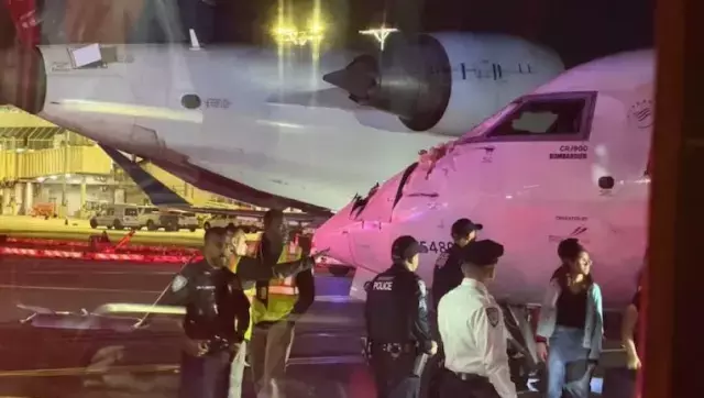 LaGuardia Havalimanı'nda pistte hareket eden iki yolcu uçağının çarpışma anına ait görüntü benzeri sahne
