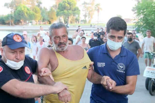 İnatçı Rus turist yüzmenin yasak olduğu gölden güçlükle çıkartıldı