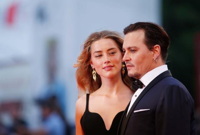 Johnny Depp'in eski eşi Amber'in ünlü modelle asansörde öpüştüğü görüntüler basına sızdı falan