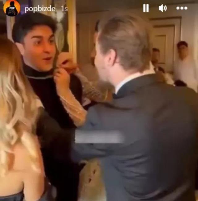 Merve Boluğur düğününe gelen TikTok fenomeni Cellat'ın boynundaki altın zinciri çıkarıp takı torbasına attı