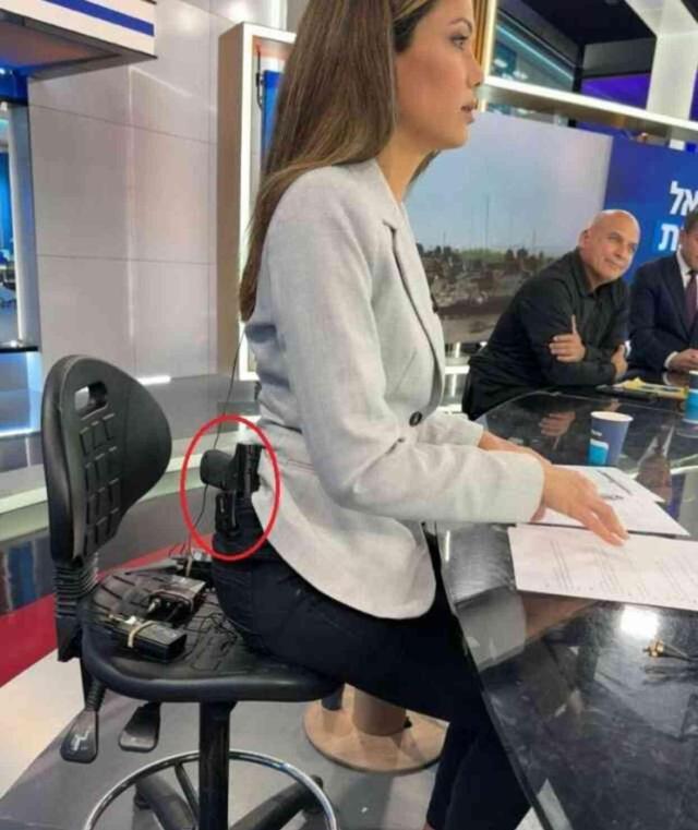 İsrailli kadın sunucu belinde silahla canlı yayına çıkarak 'Silahlanın' çağrısı yaptı
