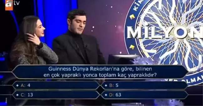 Guinness Dünya Rekorları'na göre, bilinen en çok yaprakli yonca toplam kaç yapraklıdır?