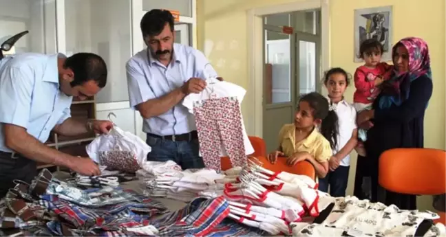 Kağızman'da Yetimlere Gıda ve Giyim Yardımı