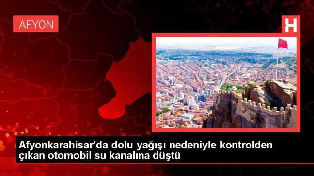Afyonkarahisar'da dolu yağışı nedeniyle kontrolden çıkan otomobil su kanalına düştü