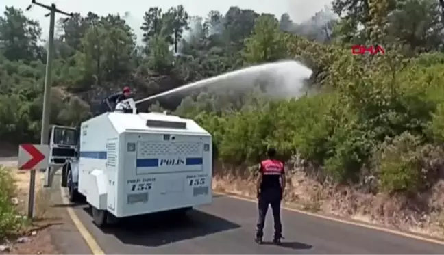 POLİS TOMA'LARI YERLEŞİM YERLERİNE 80 METRE KALA YANGINI SÖNDÜRDÜ