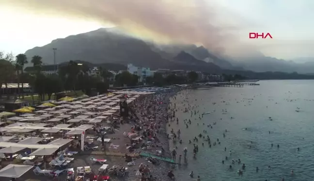 Kemer'deki Orman Yangınından Haberdar Olan Tatilcilerin Yakınlarına Dron ve Kamera Görüntüleri İle Güven Veriliyor